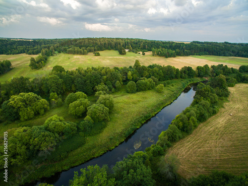 A beautiful view of the forest, fields and river from above. Drone photography 