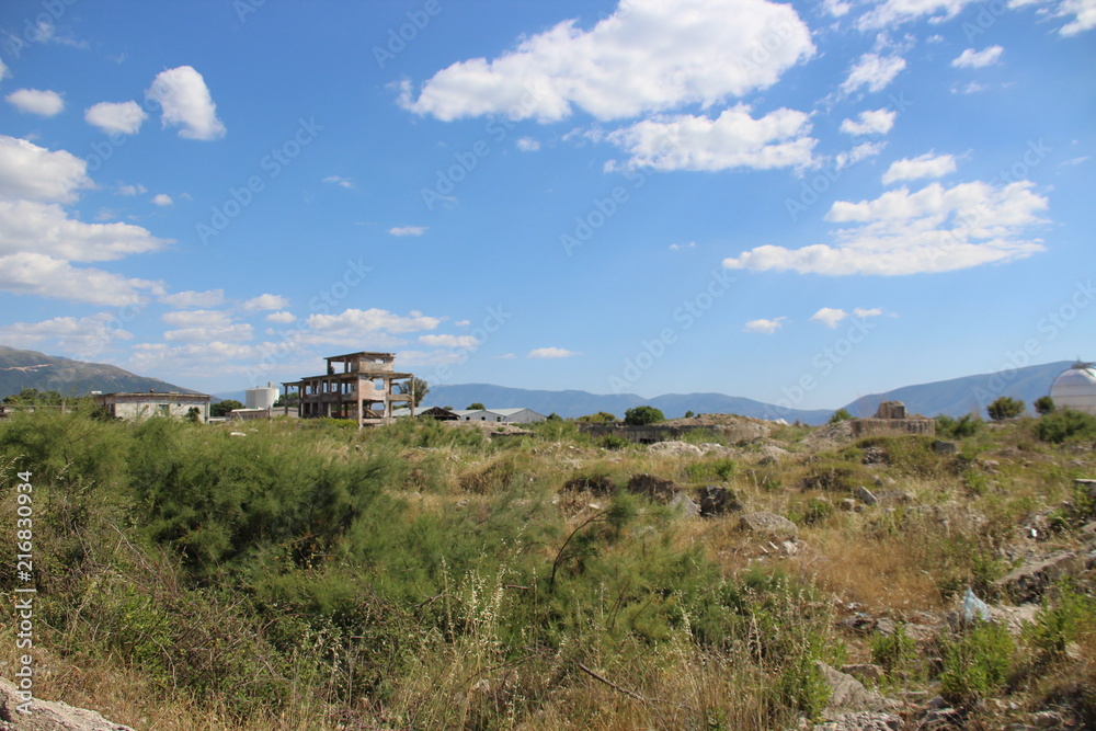View of a wide field where isolated a rough buildings are not finished View of a wide field where isolated a rough buildings are not finished