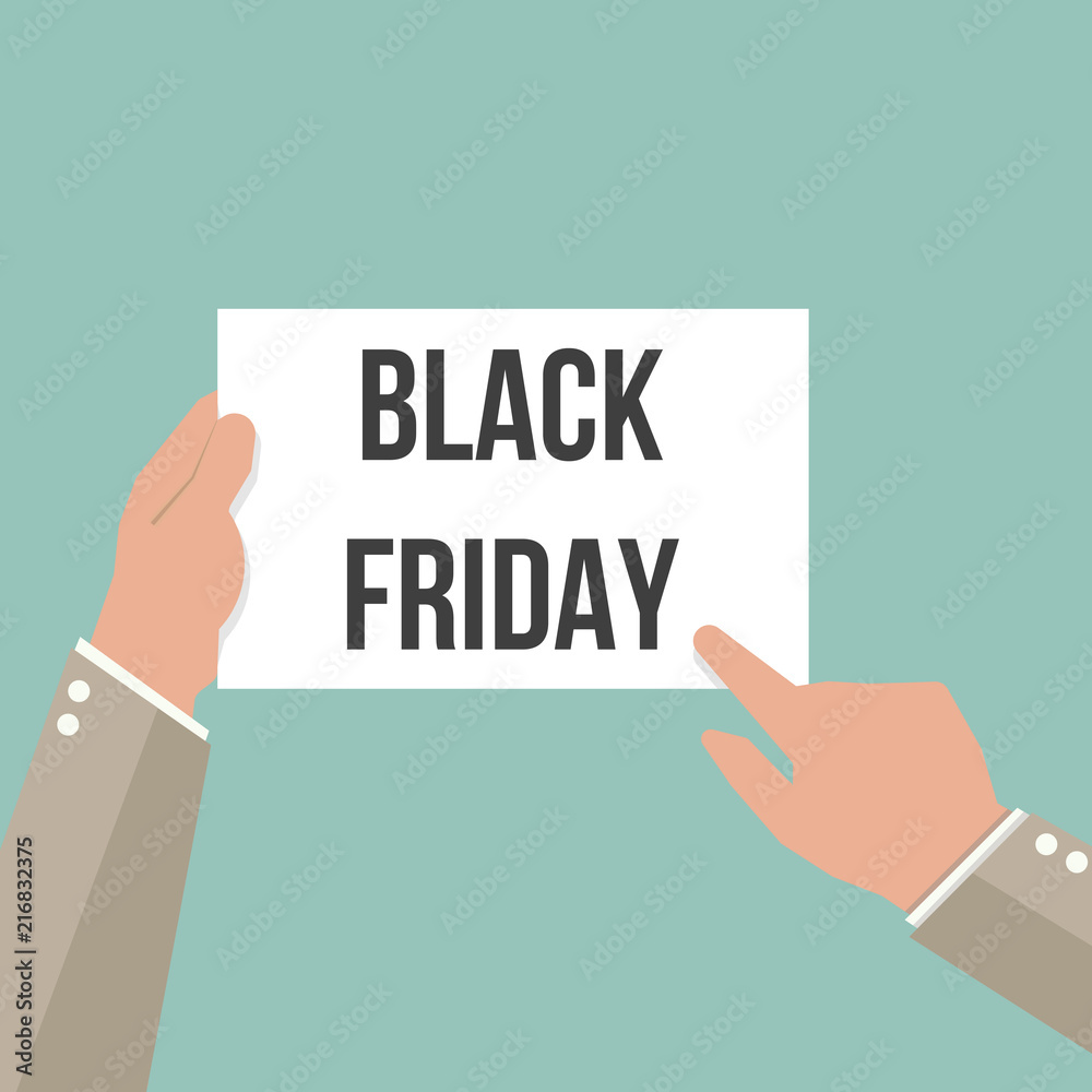 Man showing paper BLACK FRIDAY text Man showing paper BLACK FRIDAY text