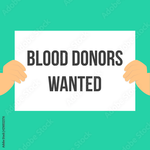 Man showing paper BLOOD DONORS WANTED
