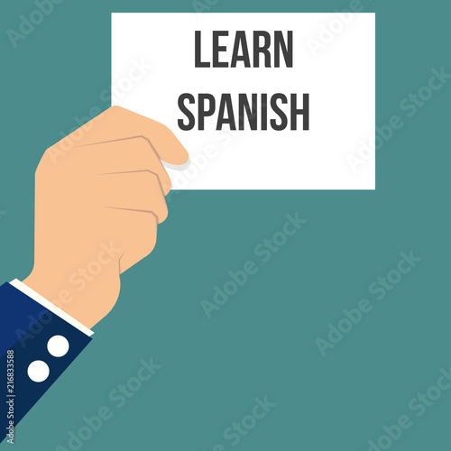 Man showing paper LEARN SPANISH text
