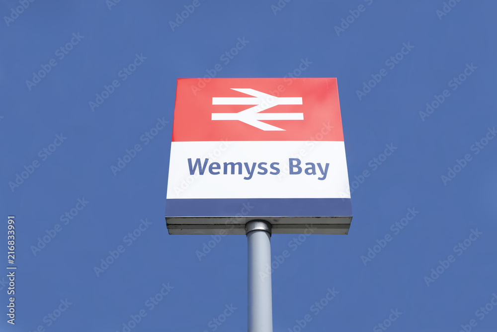 Wemyss Bay railway train station sign against blue sky background Wemyss Bay railway train station sign against blue sky background