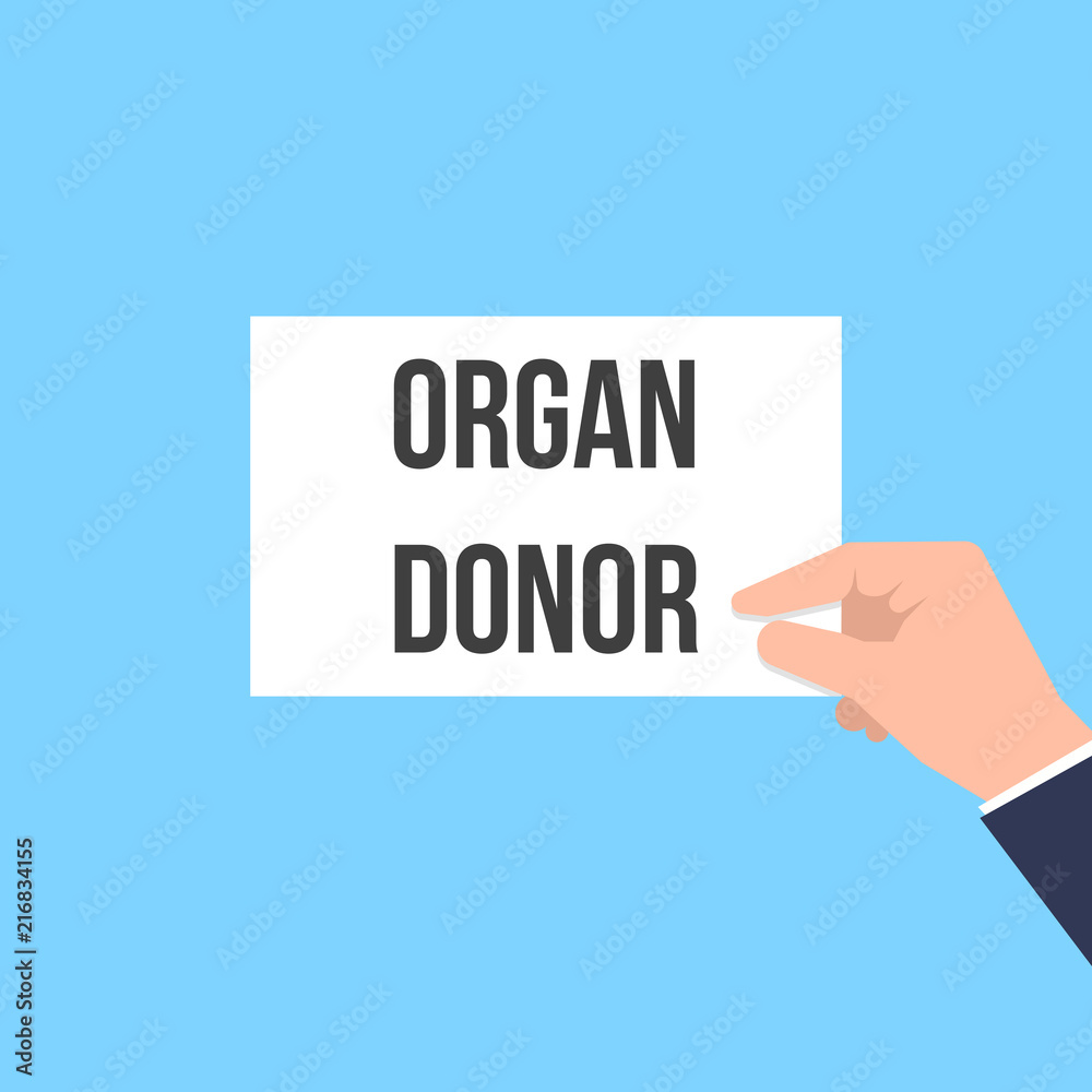 Man showing paper ORGAN DONOR text Man showing paper ORGAN DONOR text