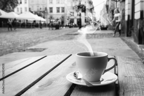 cup of coffe on the table of the outdoor cafe on the italian sidewalk.
