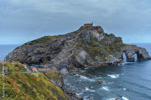 Photography A right side view of the path & stairway to the gaztelugatxe island, low tide moment