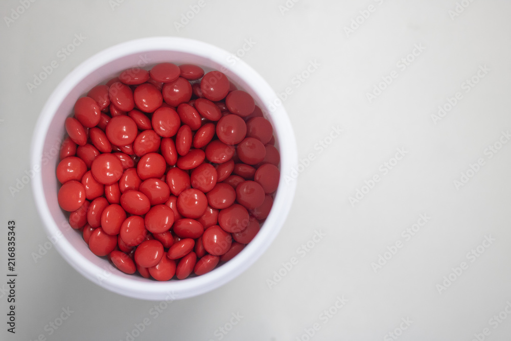 red medicine pills in can top view red medicine pills in can top view