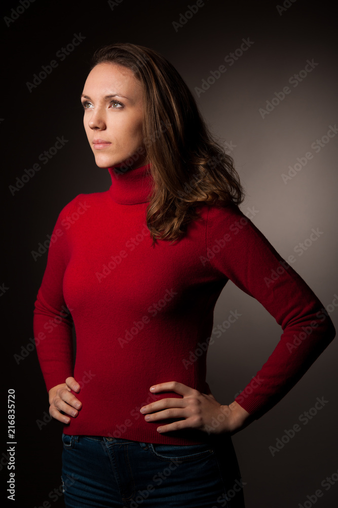creaqtive portrait of a beautiful young caucasian happy woman in red wool kneeted sweater creaqtive portrait of a beautiful young caucasian happy woman in red wool kneeted sweater