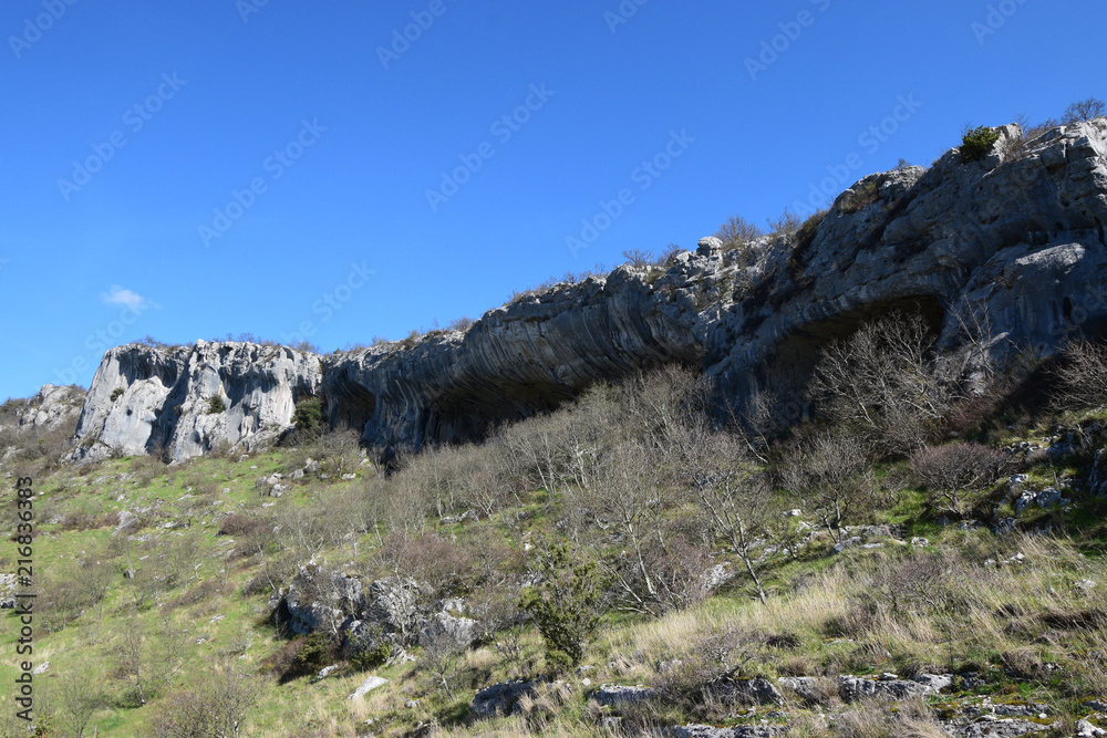 Rock shelter (abri) of Veli Badin is a shallow cave-like opening at the base of a bluff at Sočerga, Istria, Slovenia. Local people have named this rock shelters with 'Ears of Istria'. Rock shelter (abri) of Veli Badin is a shallow cave-like opening at the base of a bluff at Sočerga, Istria, Slovenia. Local people have named this rock shelters with 'Ears of Istria'.