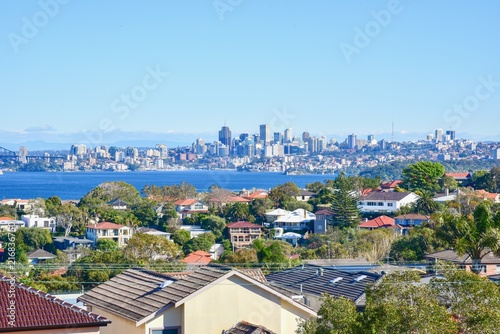 Fototapeta Naklejka Na Ścianę i Meble -  Scenic View of Residential Buildings with Sydney Skylines in the Background