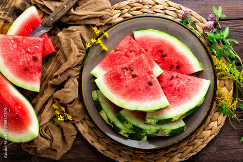 Watermelon. Fresh watermelon slices on plate on wooden rustic background