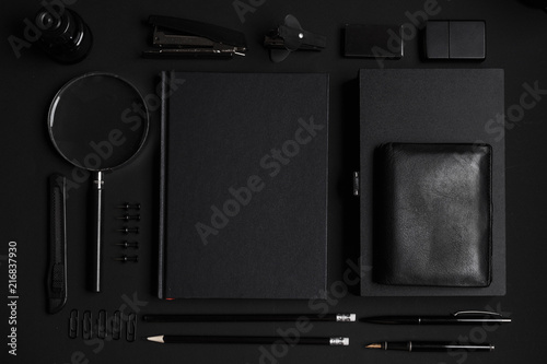 Set of black identity elements on black paper background. Black branding mockup © Max
