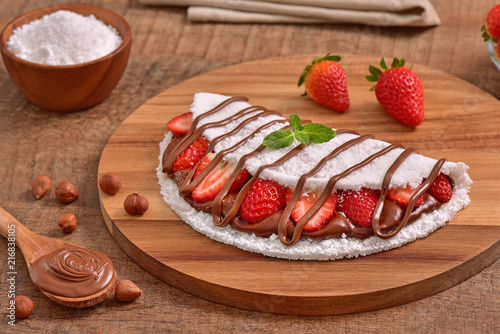 Tapioca filled with hazelnuts cream and strawberries photo
