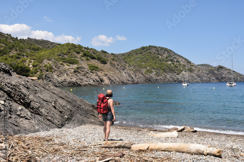 hiker woman in the Cap de Creus on the La Taballera beach, Costa Brava, Girona province, Catalonia, Spain