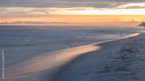 Florida white sand beach sunset after storm long exposure