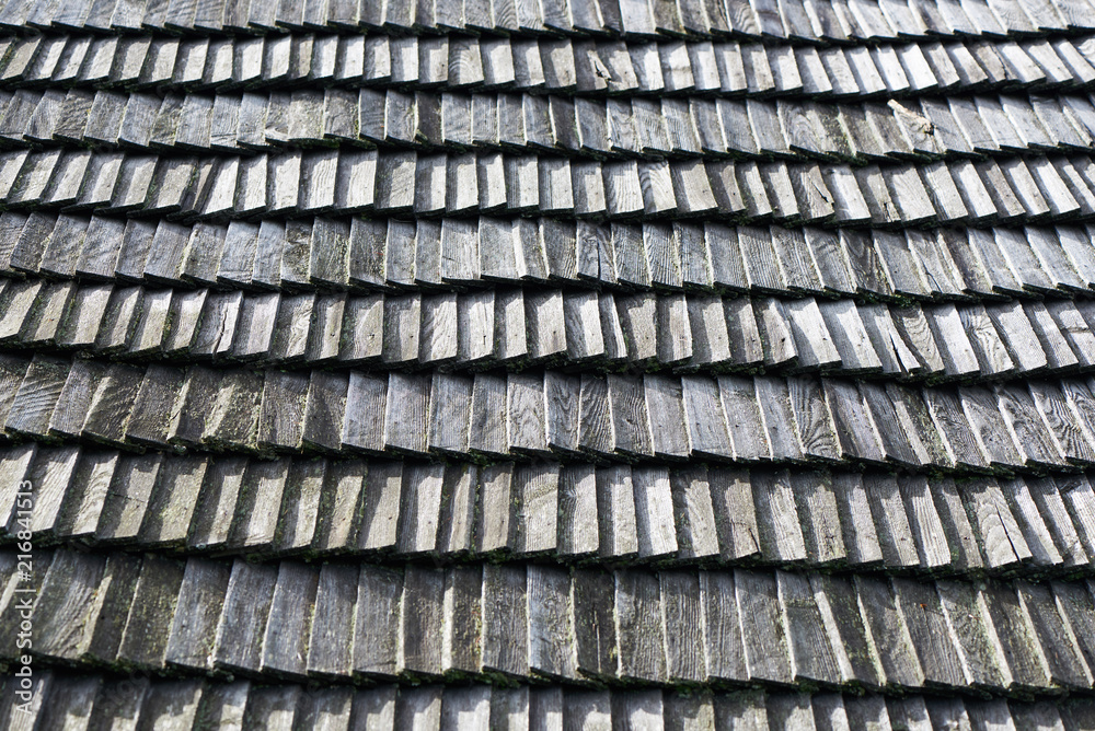 Old uneven wooden shingles, Wooden rustic roof. Old uneven wooden shingles, Wooden rustic roof.