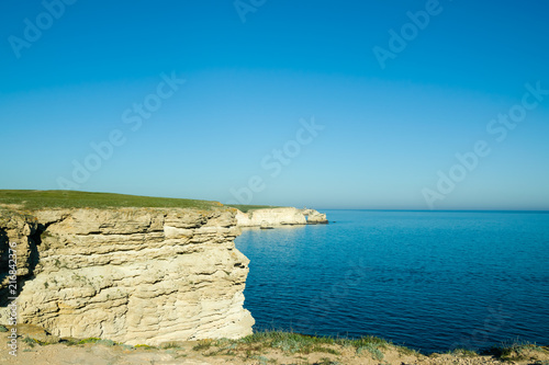 Beautiful rock off the coast of the sea. Turquoise water  blue sky  incredible landscape