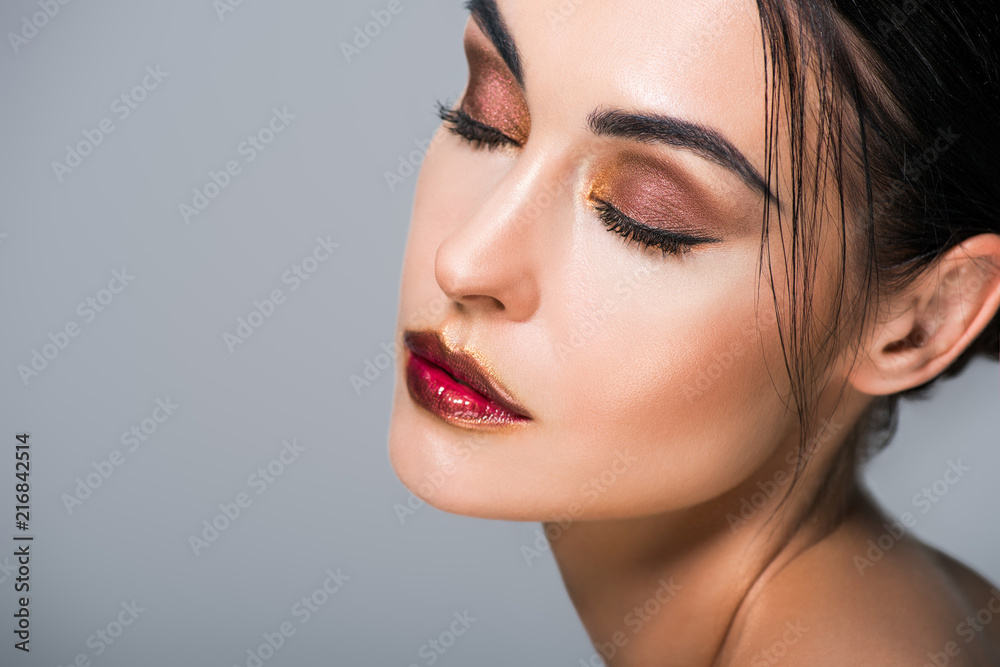 portrait of young tender woman with fashionable makeup, isolated on grey portrait of young tender woman with fashionable makeup, isolated on grey
