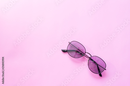 glasses or sunglasses object fashion minimal modern style, accessory travel on Pink pastel color background. Top view