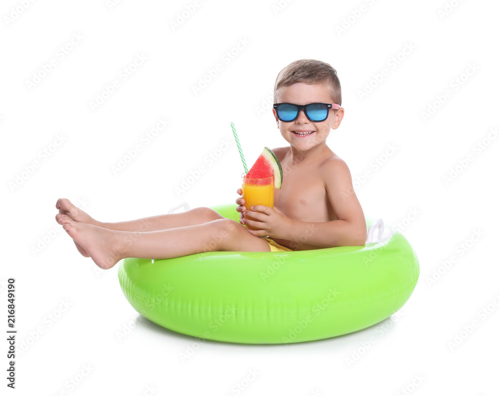 Fototapeta premium Cute little boy with inflatable ring and glass of cocktail on white background