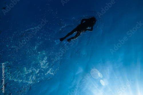 Low angle view of boy snorkeling in sea photo