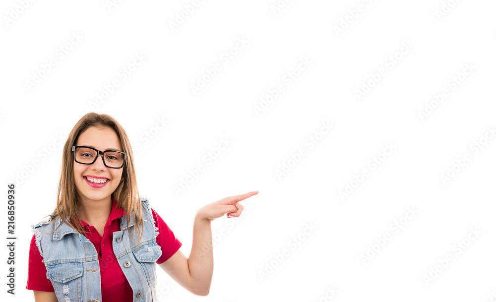 Young cute woman in glasses pointing happily away with finger Young cute woman in glasses pointing happily away with finger