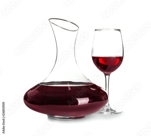 Elegant decanter and glass with red wine on white background