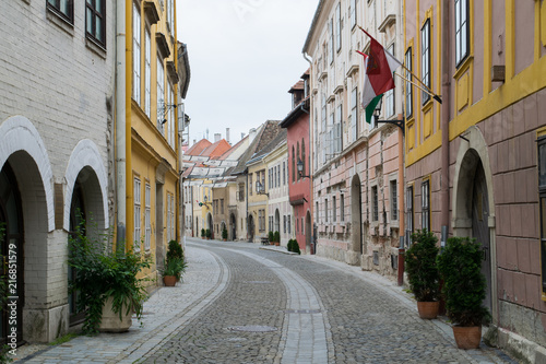 Fototapeta Naklejka Na Ścianę i Meble -  Flags line empty streets in the Old Town of Sopron, Hungary