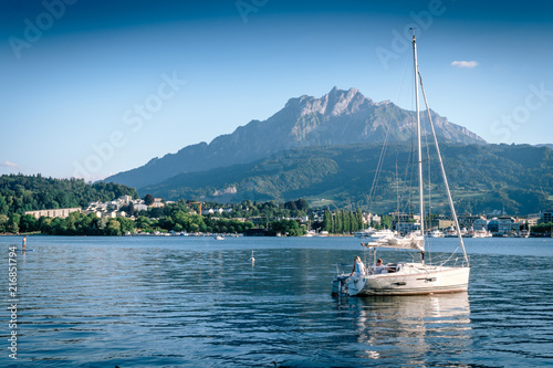 Mountain Pilatus and Sailing boat at Luzern  Switzerland  concept of travel vacation to Europe