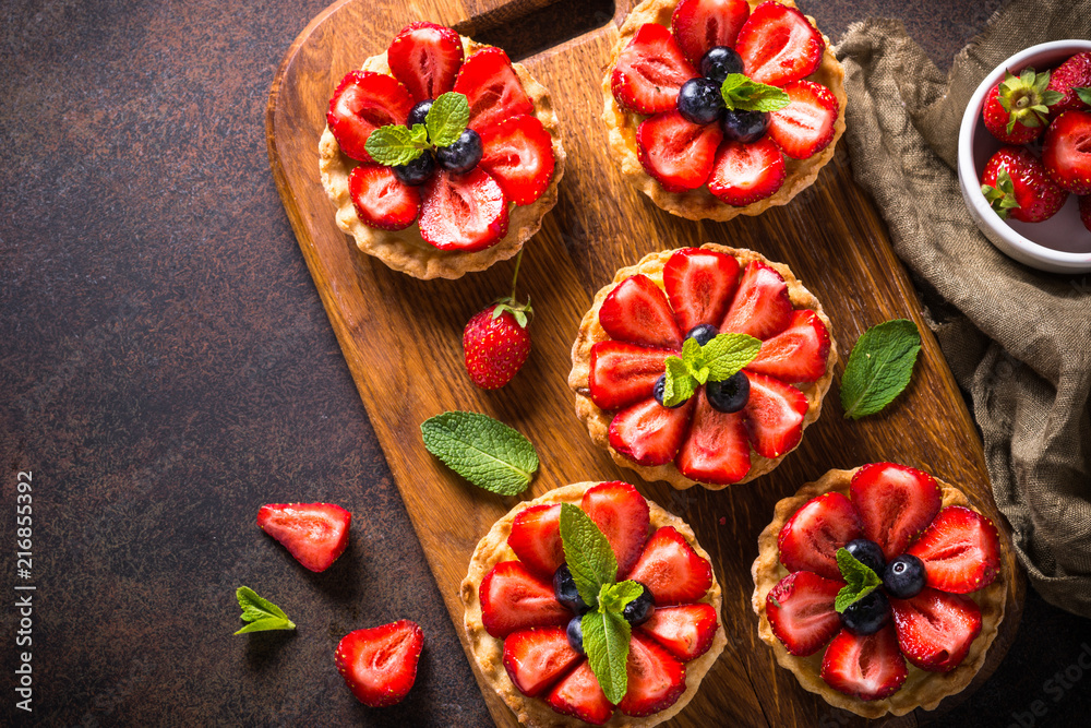 Strawberry tart on dark table. Top view. Strawberry tart on dark table. Top view.