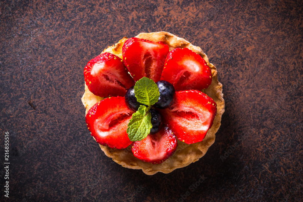 Strawberry tart on dark table. Top view. Strawberry tart on dark table. Top view.