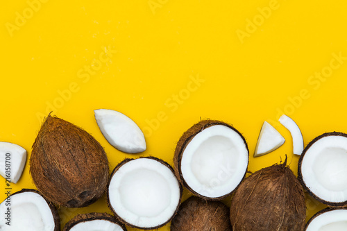 Tropical summer coconut on a yellow background.