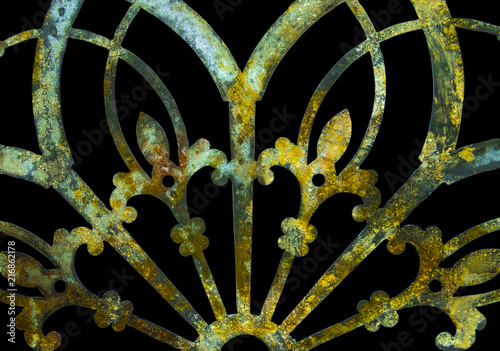 Rusty iron grunge green and yellow lacy metal decoration with fleur-de-lis isolated on black © Susan Vineyard 
