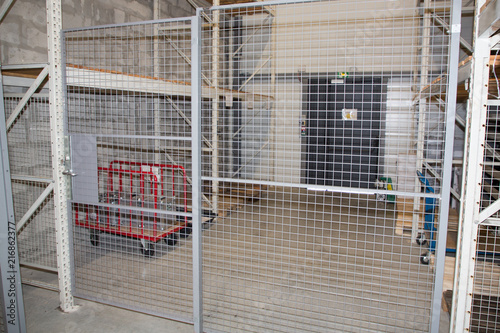 security storage with racks and a metal locked door warehouse photo