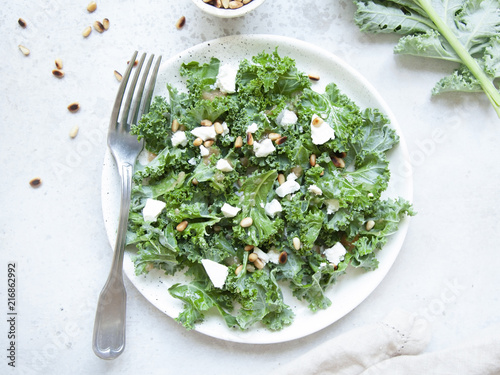 Fresh kale salad with goat cheese, pine nuts and sweet balsamic vinegar dressing.