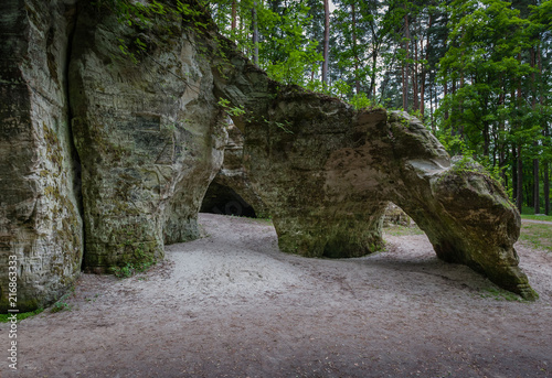 Natural sandstone arch. View of the Little Hell, Latvia. Landscape. Overall plan.