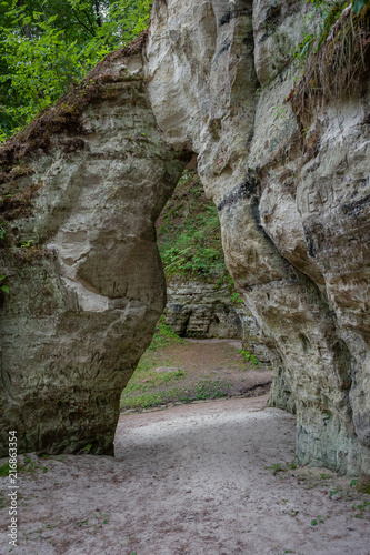 Natural sandstone arch. View of the Little Hell, Latvia. Landscape. Close-up. Soft focus.