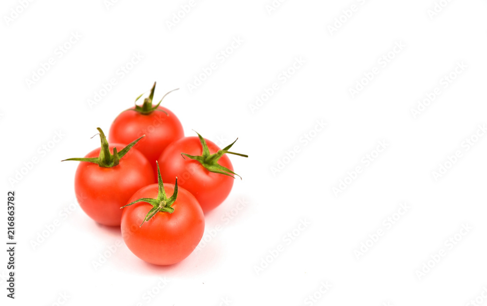 Fresh cherry tomatoes on white background with space for text. Fresh cherry tomatoes on white background with space for text.