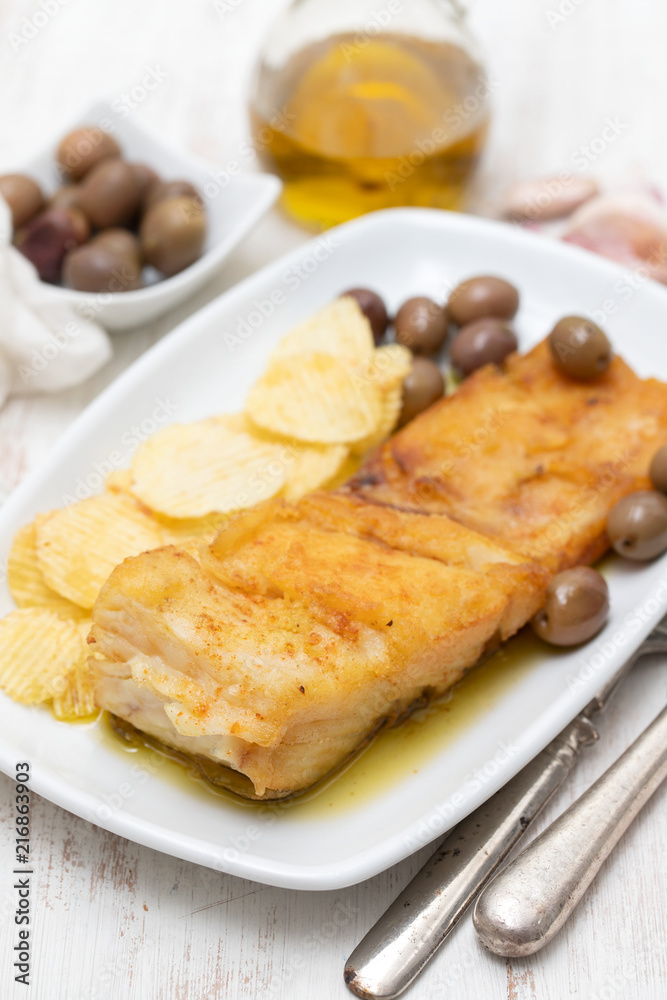 fried cod fish with olive oil on dish