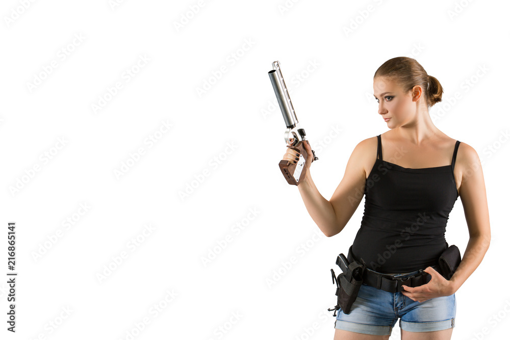 Young beautiful woman holding a sport gun on white background
