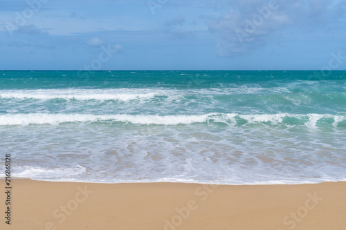 Sea view from tropical beach with sunny sky. Summer paradise beach of Bali island. Tropical shore. Tropical sea in Bali. Exotic summer beach with clouds on horizon. Ocean beach relax, Outdoor travel