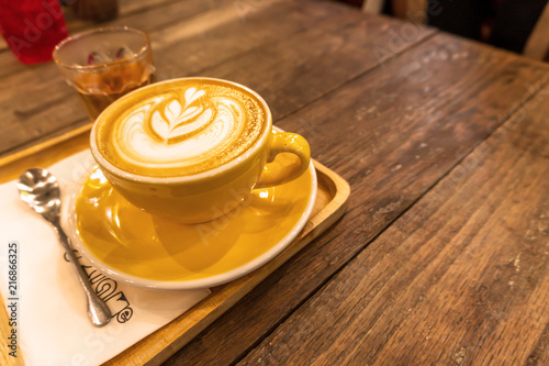 coffee cup in coffee shop ans tee Put on the wooden brown