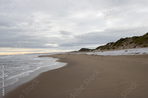 View of Snow Covered Beach in the Evening © jmclellon