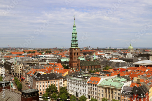 Fototapeta Naklejka Na Ścianę i Meble -   The tower building Nikolaj Church, original church, medieval period, renaissance style copper-clad spire, Copenhagen, Denmark.