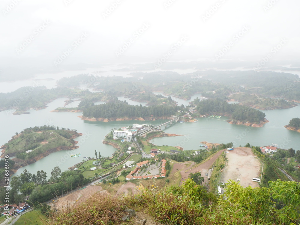 View from the The Rock of Guatape on a cloudy and rainy day, La Piedra or El Peñol, The Stone of El Peñol in Colombia. 