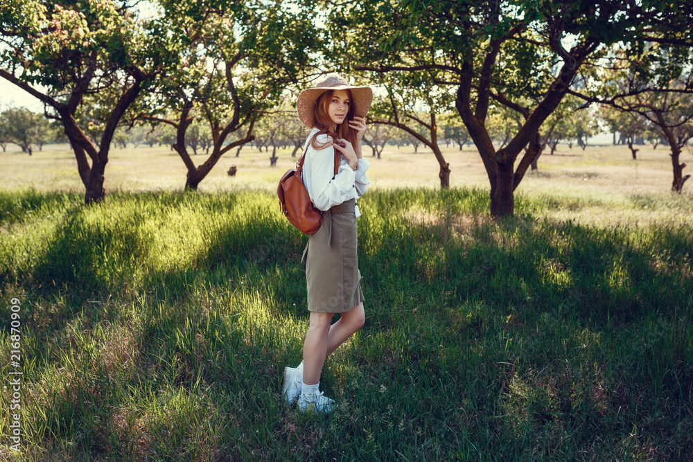 young girl in a straw hat travels green meadows young girl in a straw hat travels green meadows