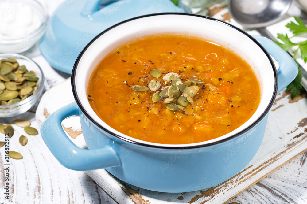healthy lunch. spicy pumpkin soup with lentils in a saucepan, closeup healthy lunch. spicy pumpkin soup with lentils in a saucepan, closeup