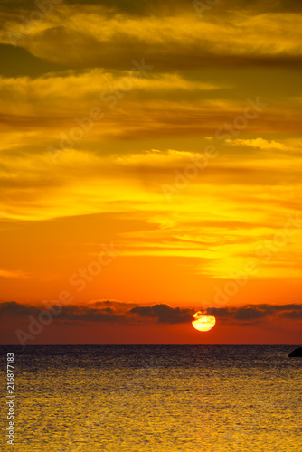 Sunrise or sunset over sea surface