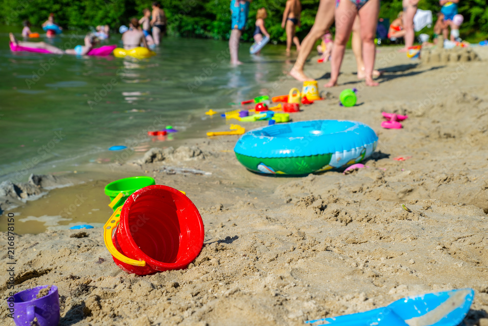 inflatable ring kids toys at sand beach close up. nobody inflatable ring kids toys at sand beach close up. nobody