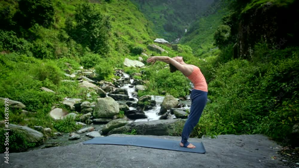Woman doing yoga Sun Salutation Surya Namaskar Woman doing yoga Sun Salutation Surya Namaskar