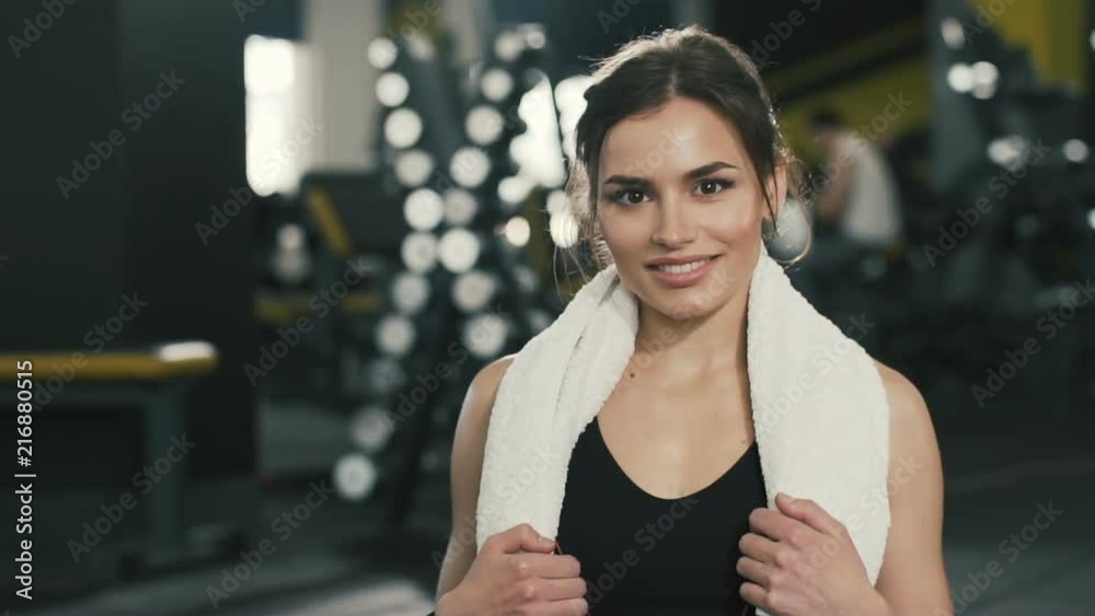 Beautiful sportive girl at gym background